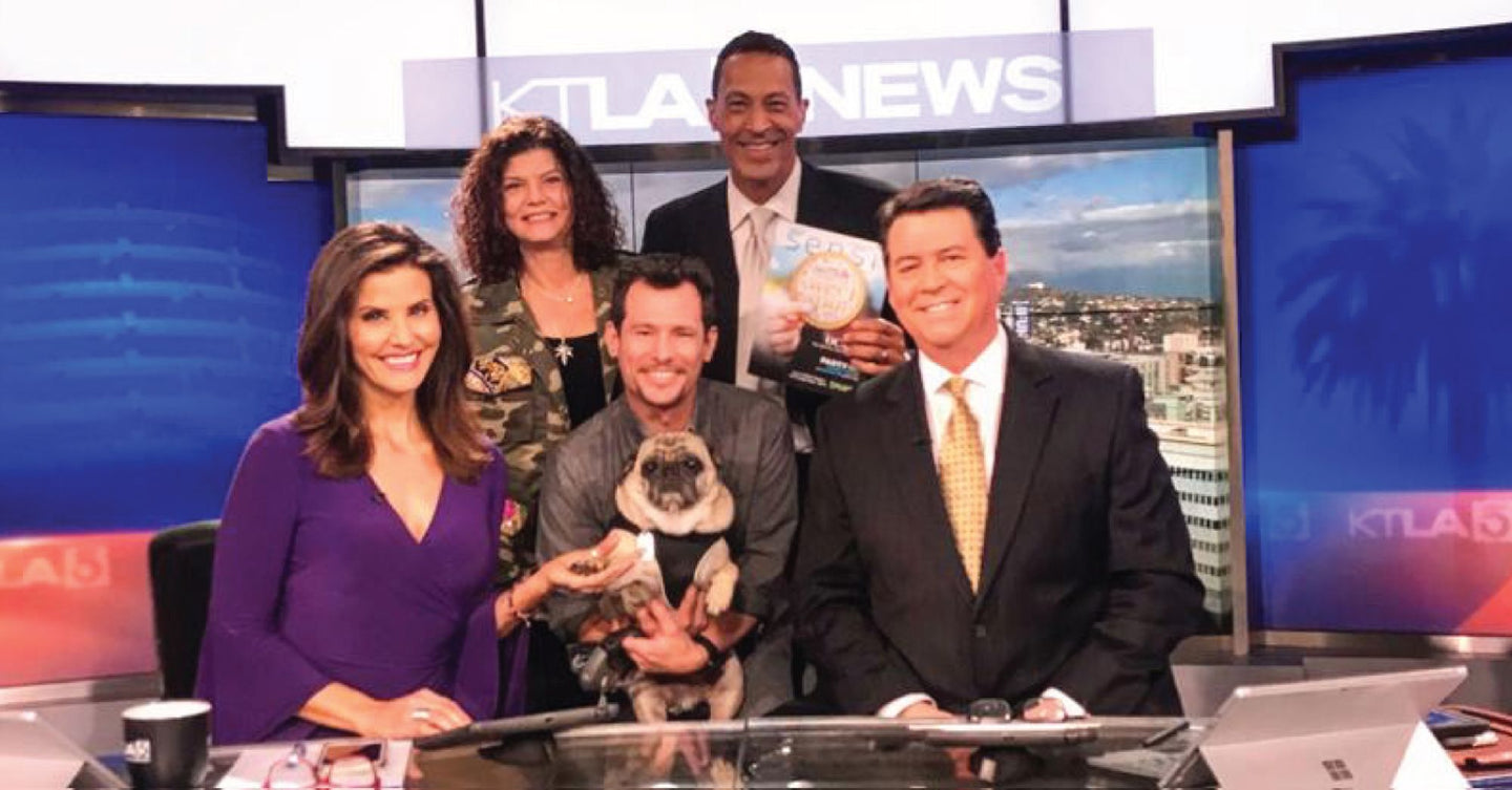 Bailey's CBD featured on KTLA News with anchors and Bailey the pug.